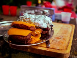 Cheeseburgers and hotdogs at the annual summer picnic